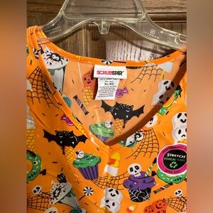 Scrub star orange Halloween top